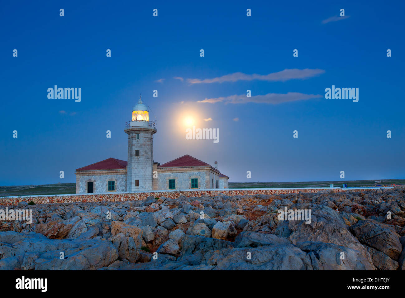 Ciutadella Menorca Punta Nati lighthouse with moon shining in sky Stock Photo