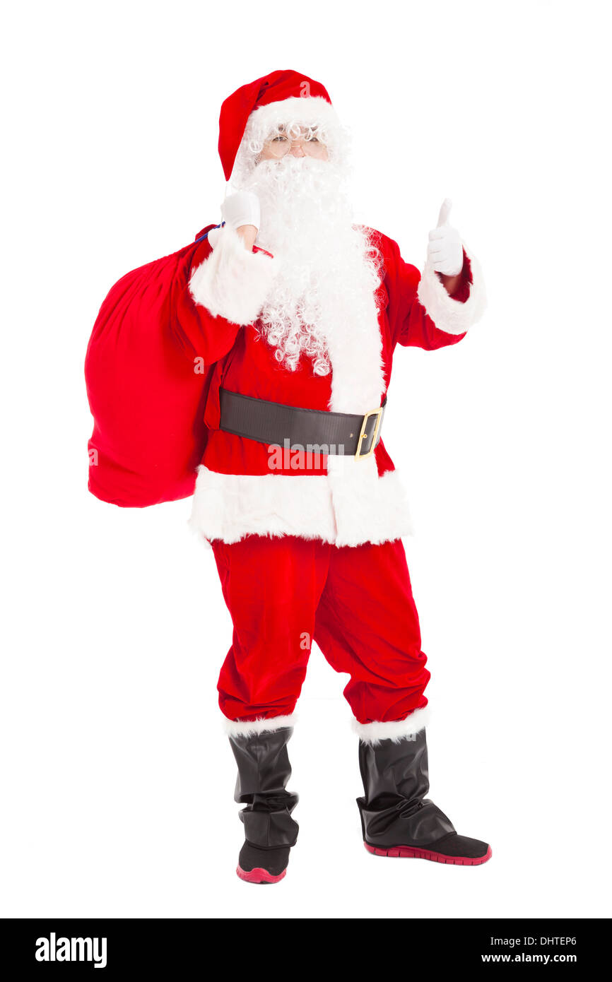 merry Christmas Santa Claus holding gift bag with thumb up Stock Photo
