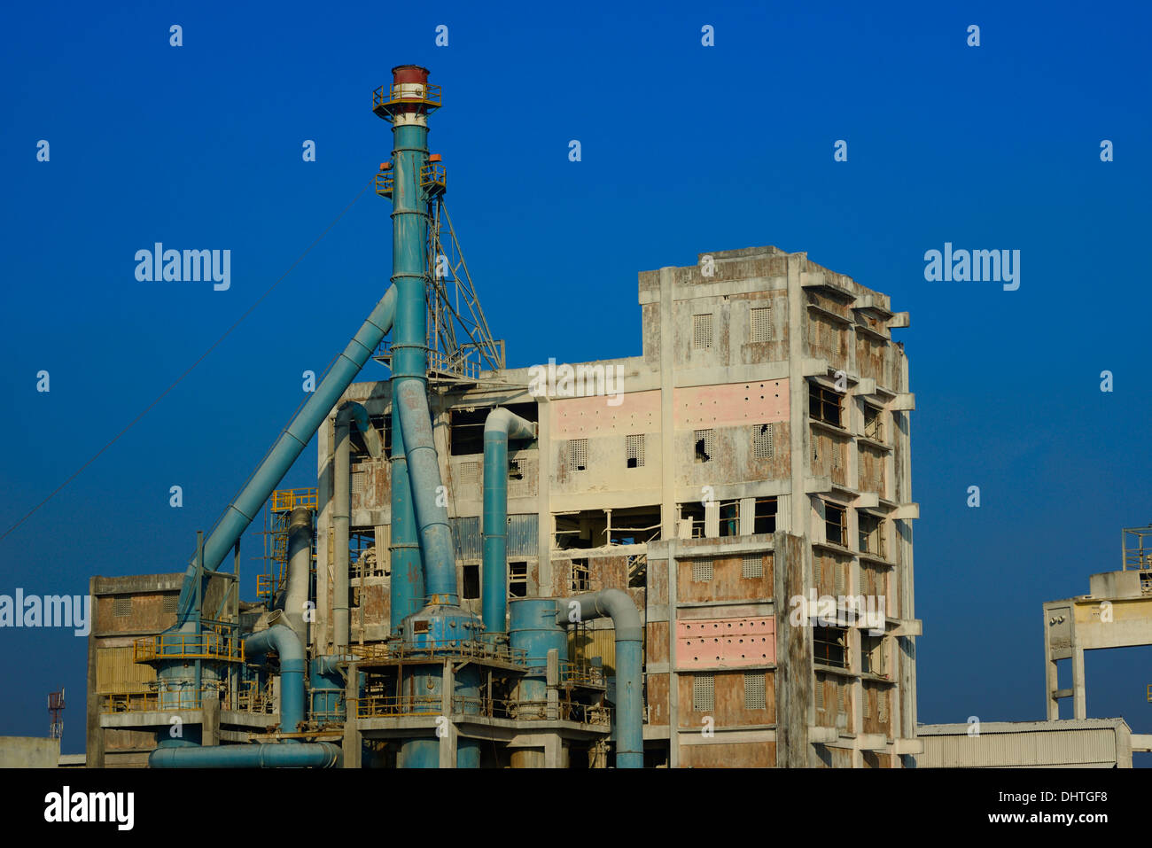 Factory emitting smoke on a bright sunny day Stock Photo