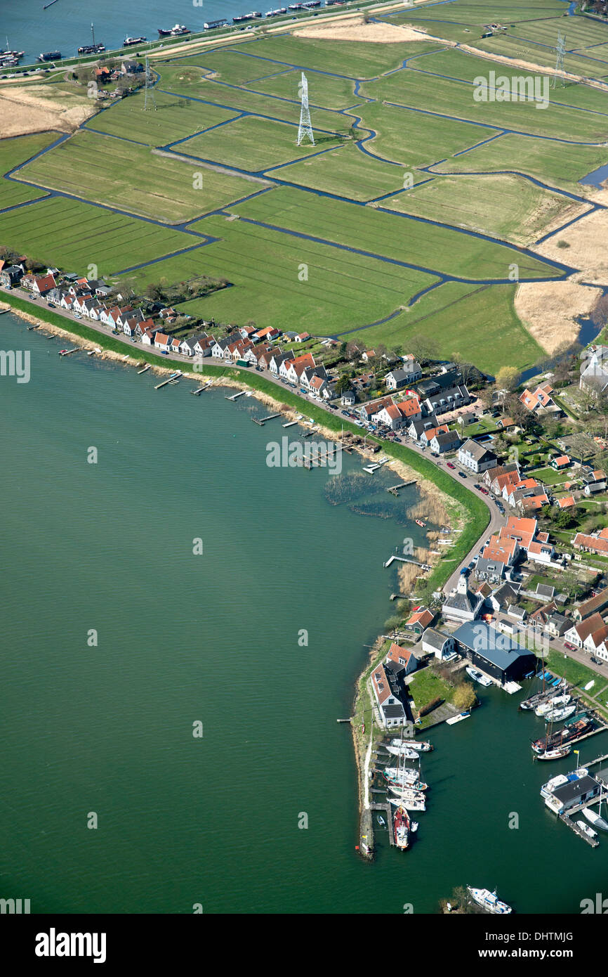 The Netherlands, Durgerdam, Amsterdam, Houses on dyke of lake called IJmeer. Aerial. Stock Photo