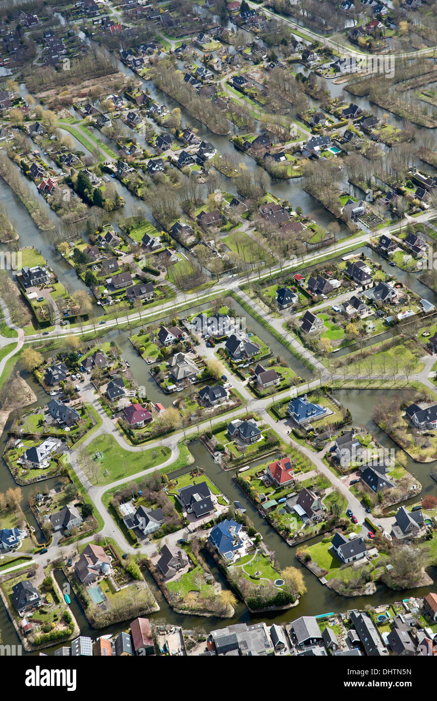 Netherlands, Broek op Langedijk, Luxury houses on peat land. Aerial. Stock Photo