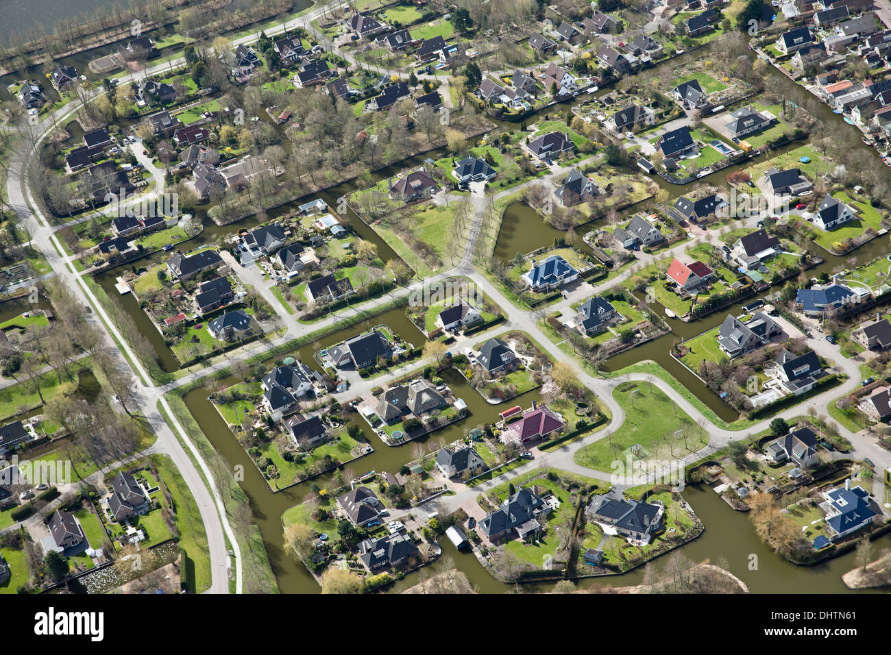 Netherlands, Broek op Langedijk, Luxury houses on peat land. Aerial. Stock Photo