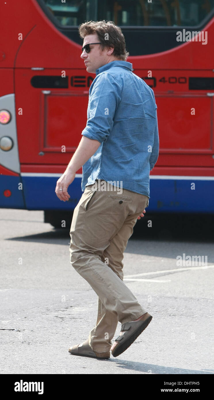 Jamie Oliver collects his daughters, Poppy Honey and Daisy Boo, from school London, England - 23.05.12 Stock Photo