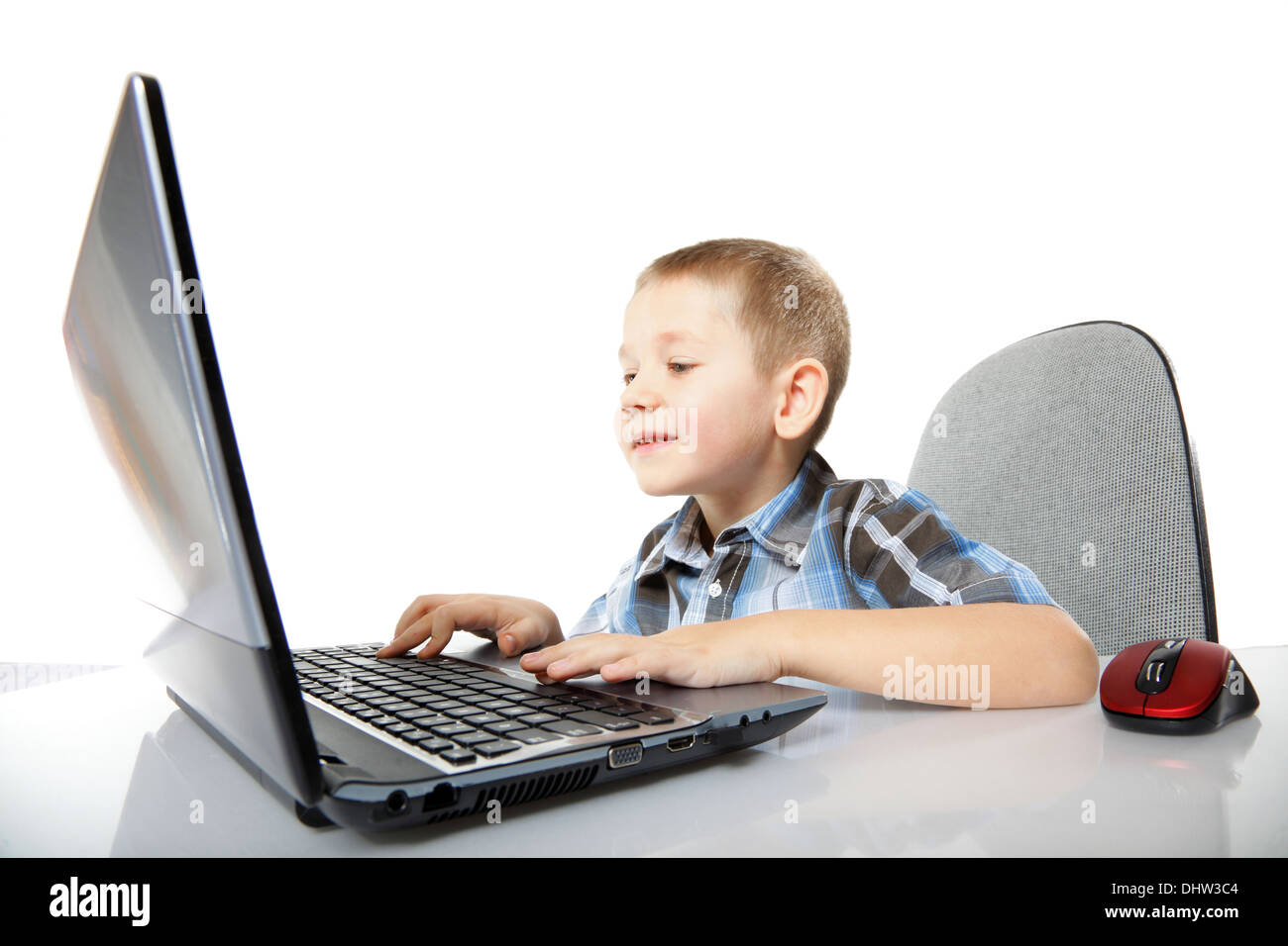 Computer addiction child boy with laptop notebook white background