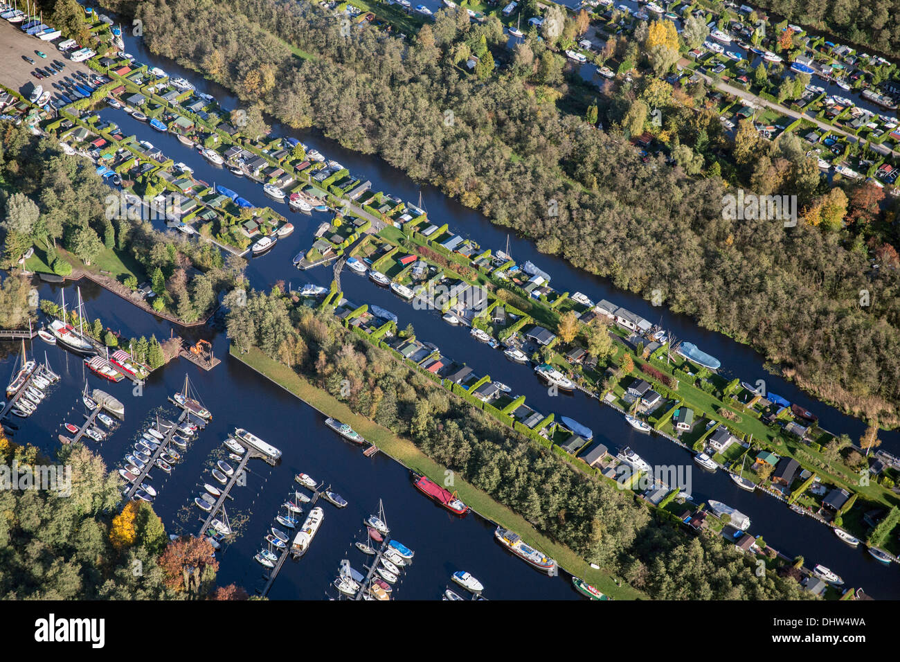 Netherlands, Loosdrecht, Holiday houses near lakes called Loosdrechtse Plassen. Aerial Stock Photo