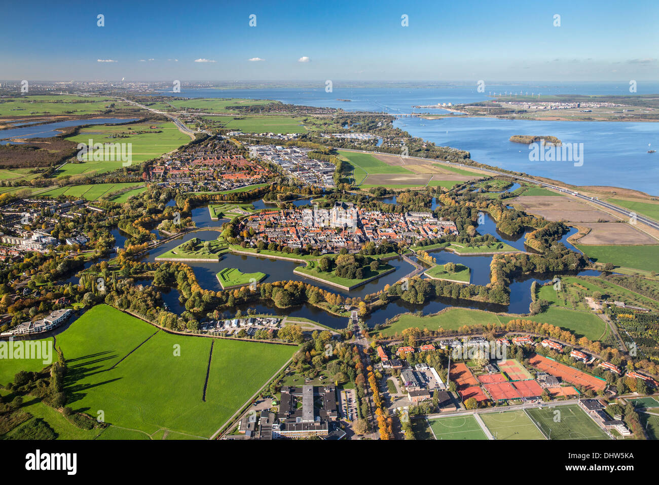 Netherlands, Naarden, Star shaped fortified village with canals, ramparts, bastions and ravelins. Aerial Stock Photo
