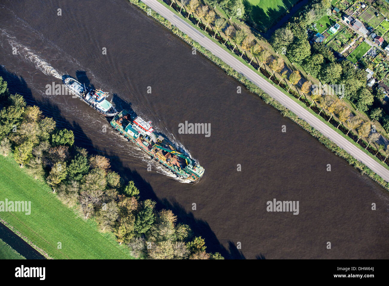 Netherlands, Weesp, Canal called Amsterdam-Rijnkanaal. Cargo ship. Aerial Stock Photo