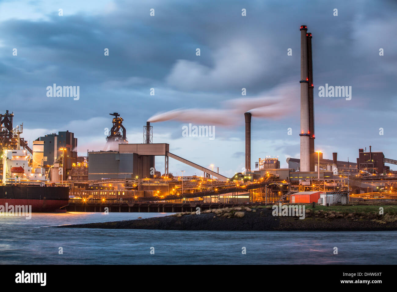 Factory Tata Steel with smoking chimneys on a sunny day, IJmuiden, The  Netherlands Stock Photo