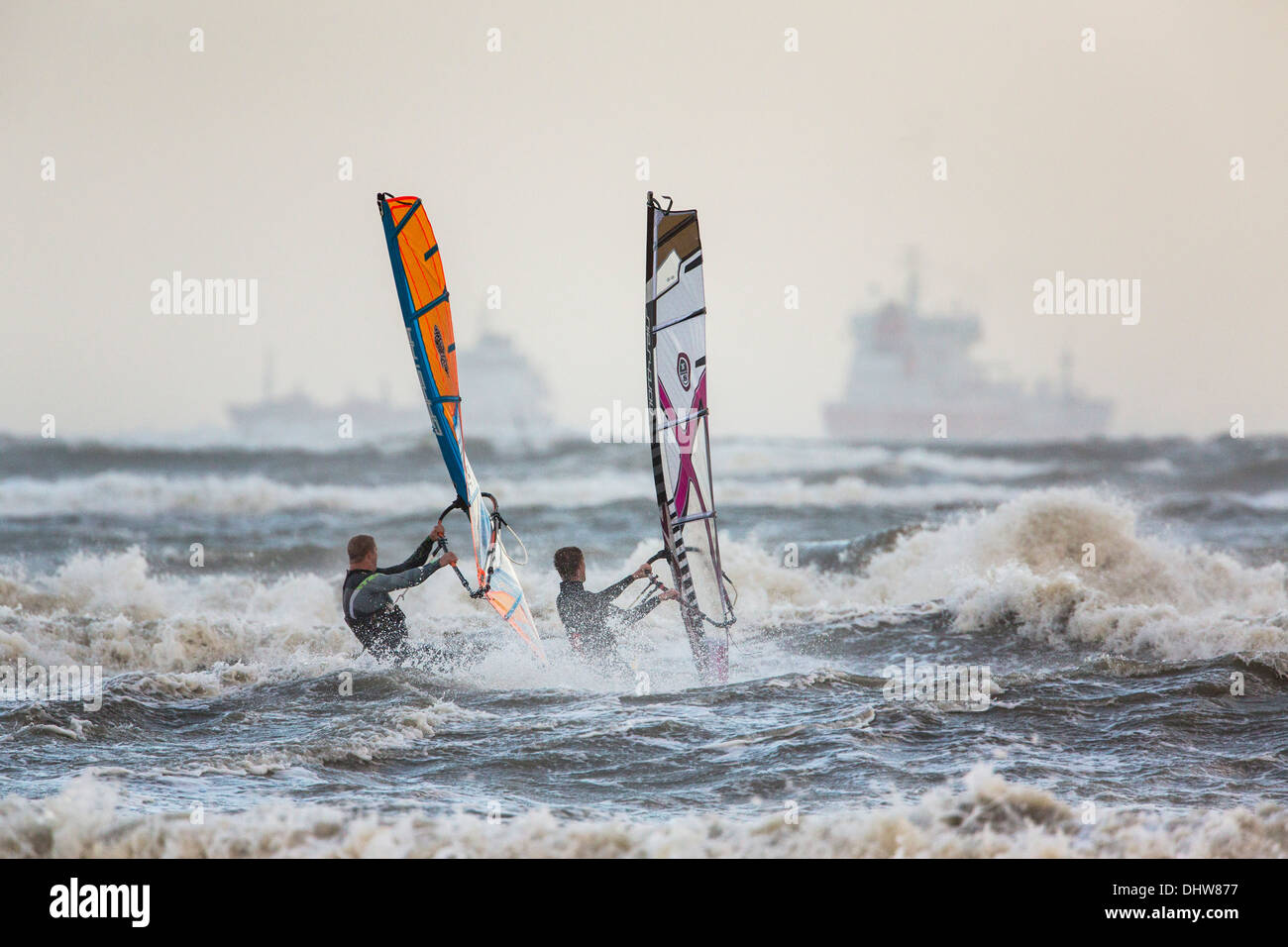 Netherlands, Velsen-Noord near IJmuiden, Heavy stoL on North Sea. Wind surfing. Background cargo ship Stock Photo