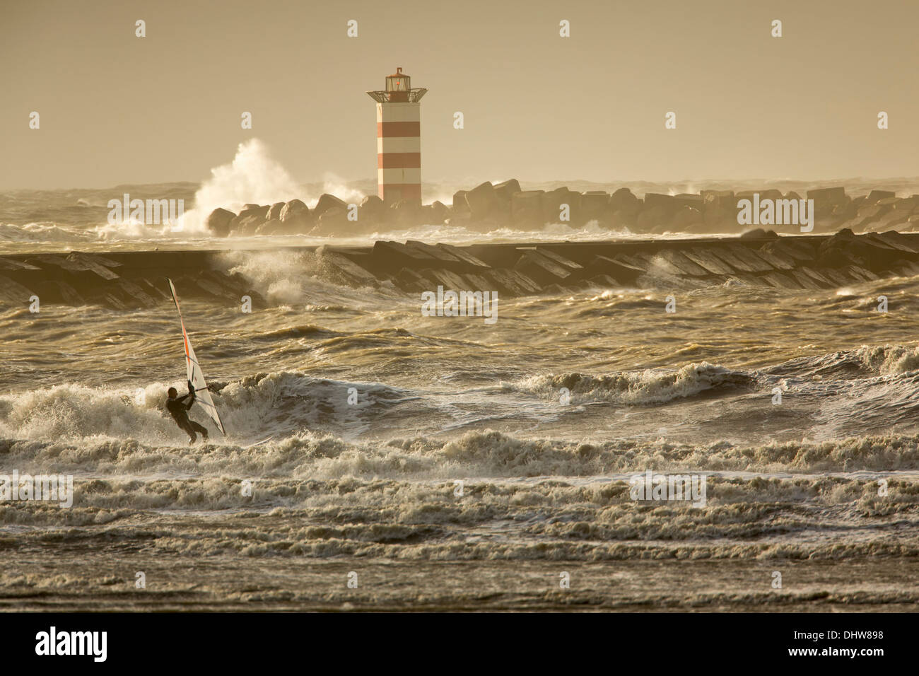 Netherlands, Velsen-Noord near IJmuiden, Heavy stoL on North Sea. Waves break on beacon. Wind surfing Stock Photo