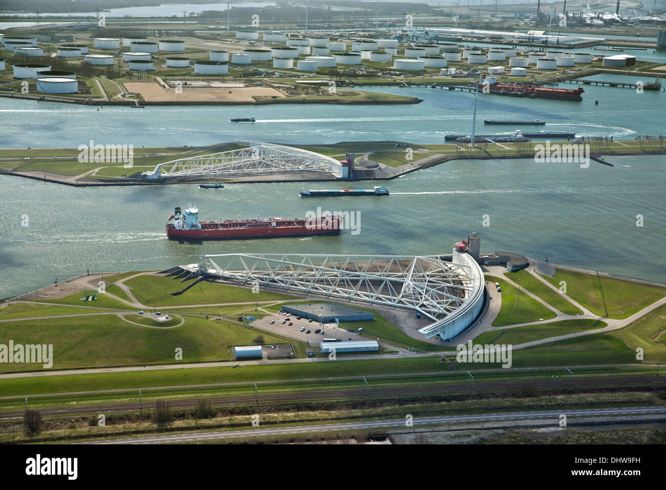 Holland, Rotterdam, Port. Maeslant barrier, Maeslantkering. Storm surge barrier Delta works. Oil storage chemical tanker. Aerial Stock Photo