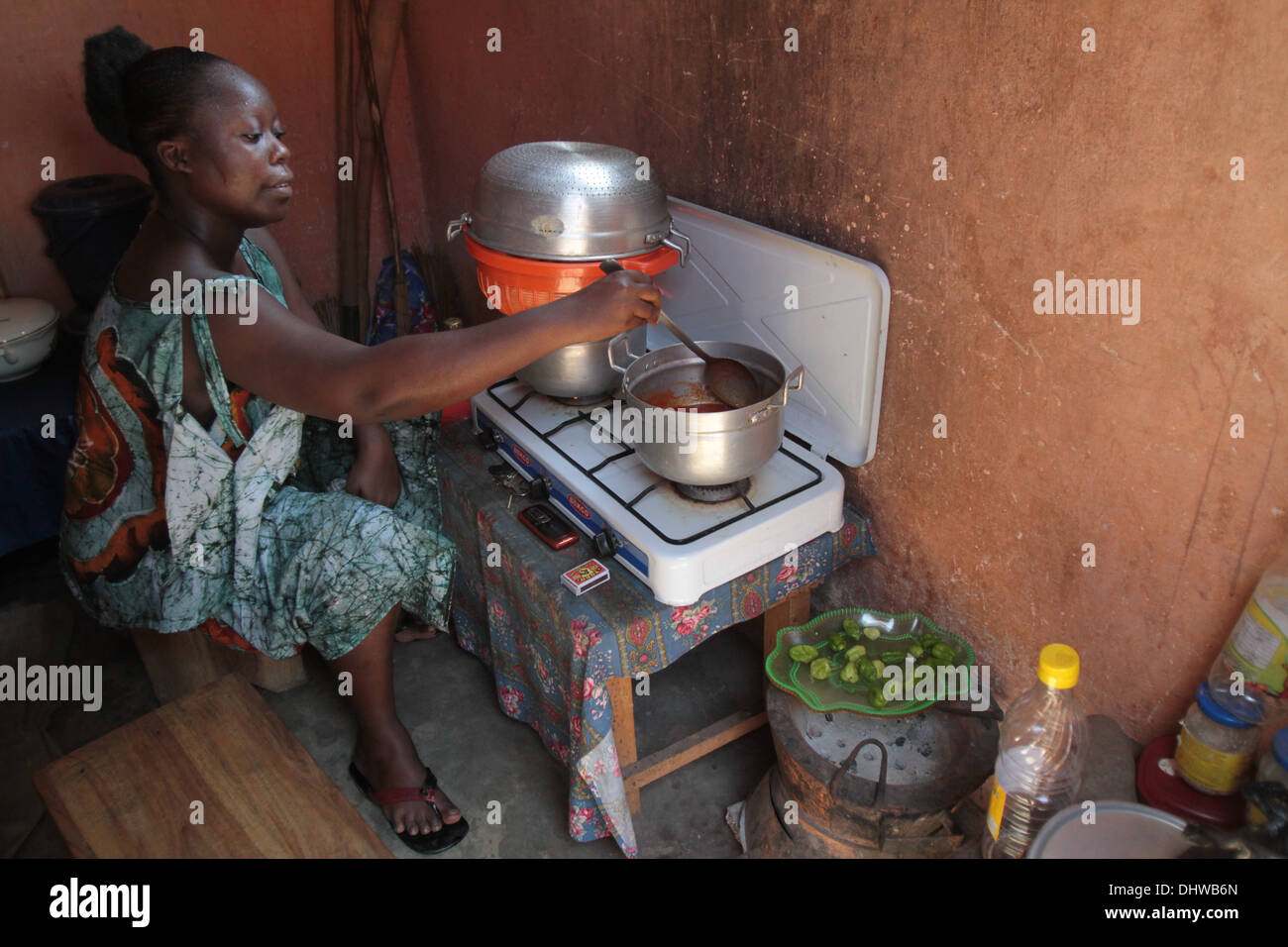 African woman cooking dinner. Stock Photo