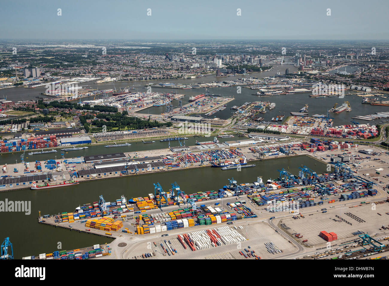Netherlands, Rotterdam, Port of Rotterdam. Container storage in area called Botlek. Background city center. Aerial Stock Photo