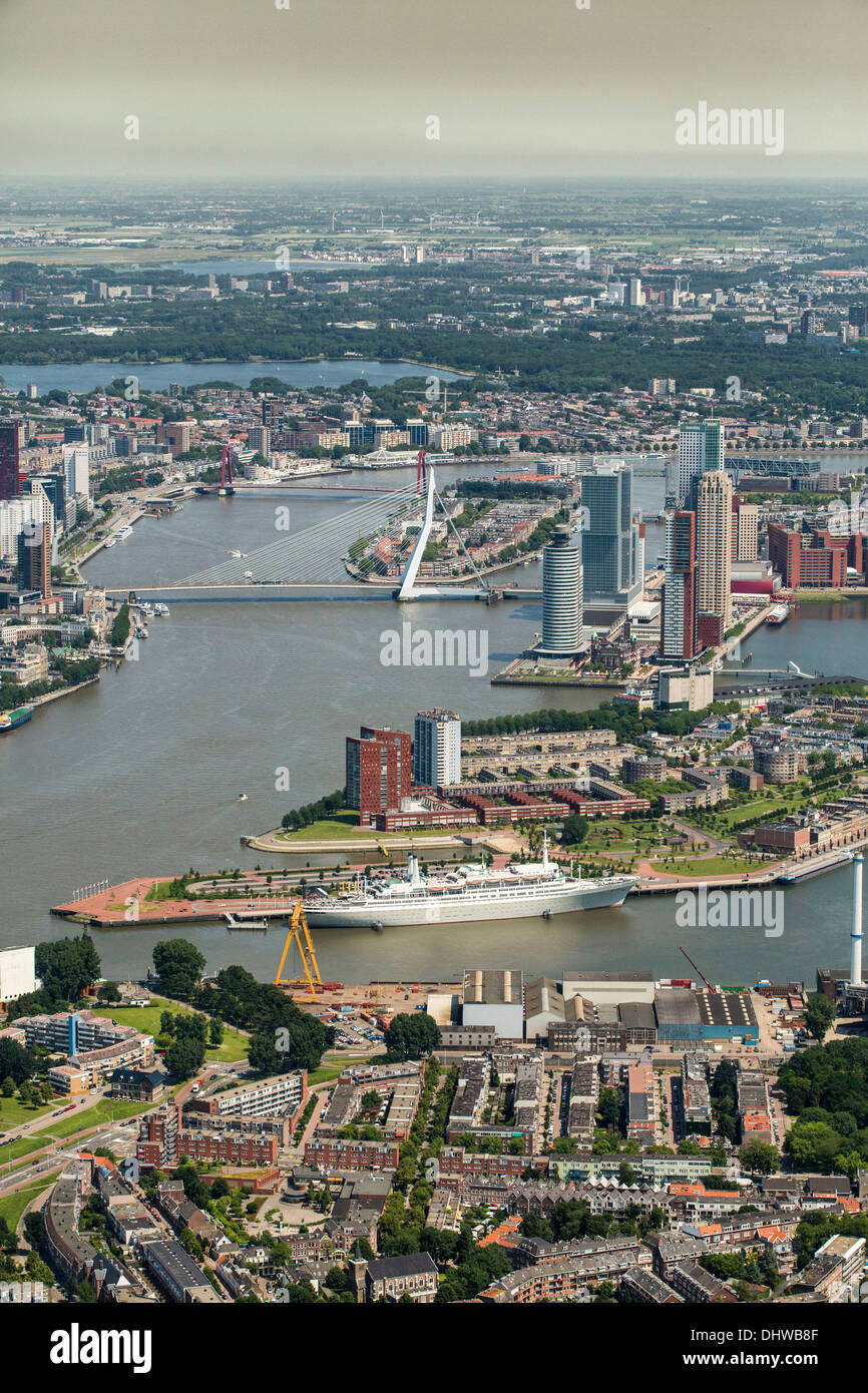 Netherlands, Rotterdam, View on city center. Foreground historic ship called MS Rotterdam. Aerial Stock Photo