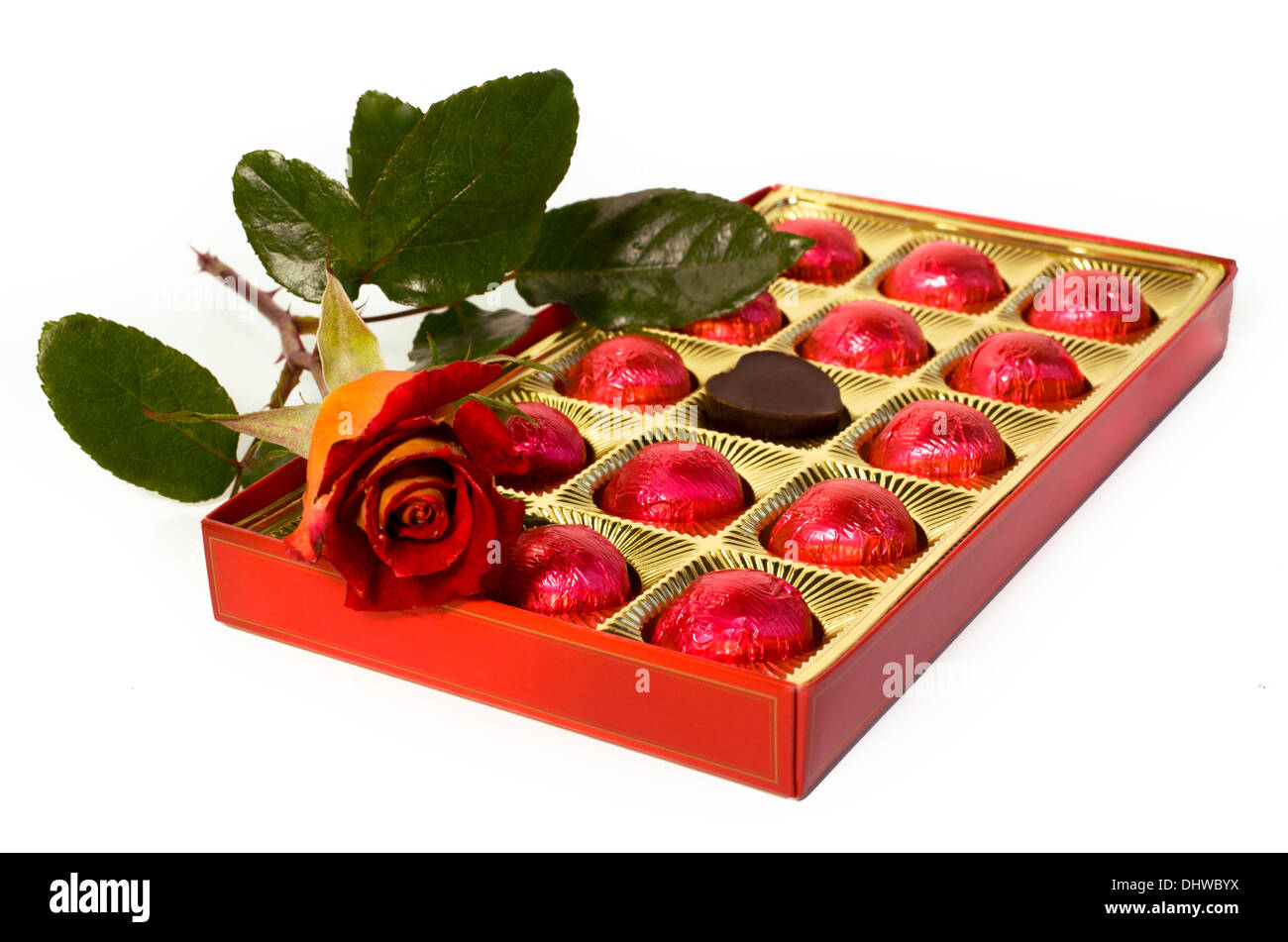 red and yellow roses and box of chocolates Stock Photo