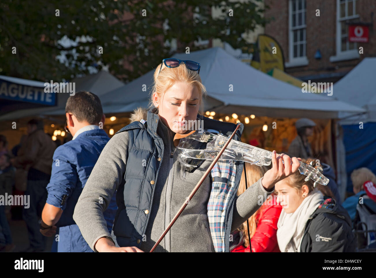 Young woman busker street musician High Resolution Stock Photography
