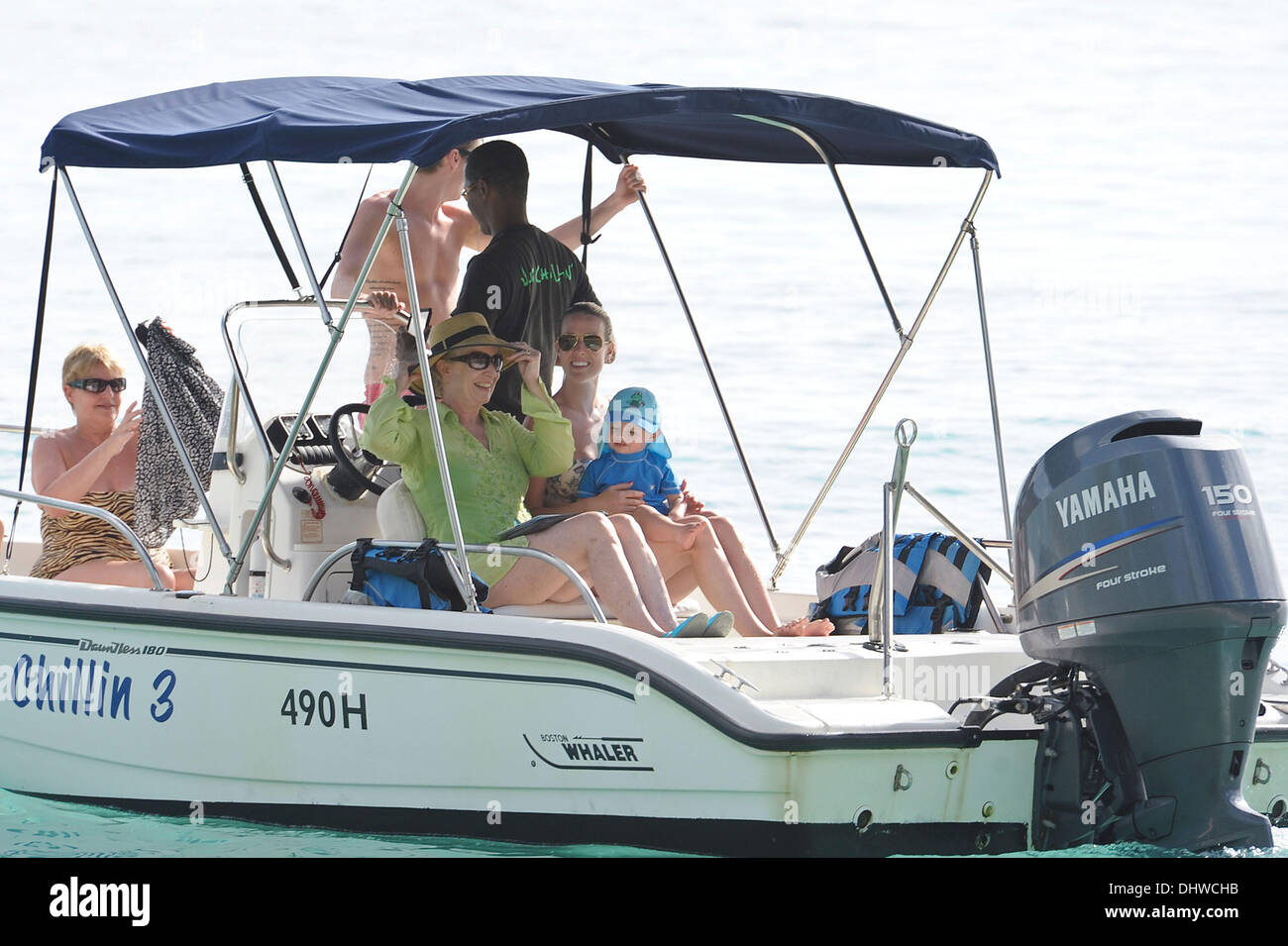 Manchester United midfielder, Michael Carrick on a boat trip with wife Lisa who holds her son Jacey while on holiday in Barbados. Barbados - 28.05.12 Stock Photo