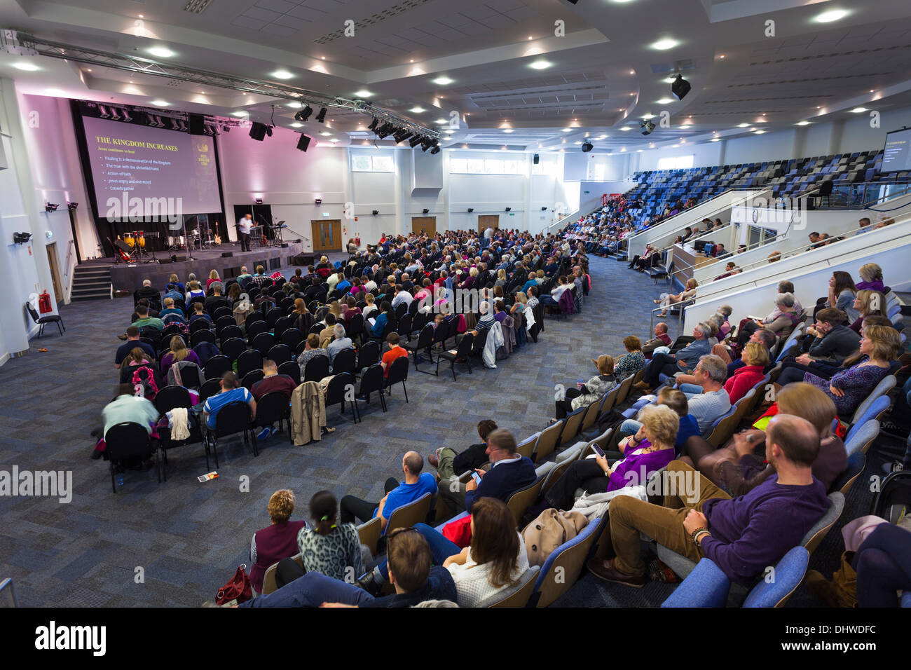 Congregation listening to the pastor during Sunday Service inside the large modern Kings Community Church. Stock Photo