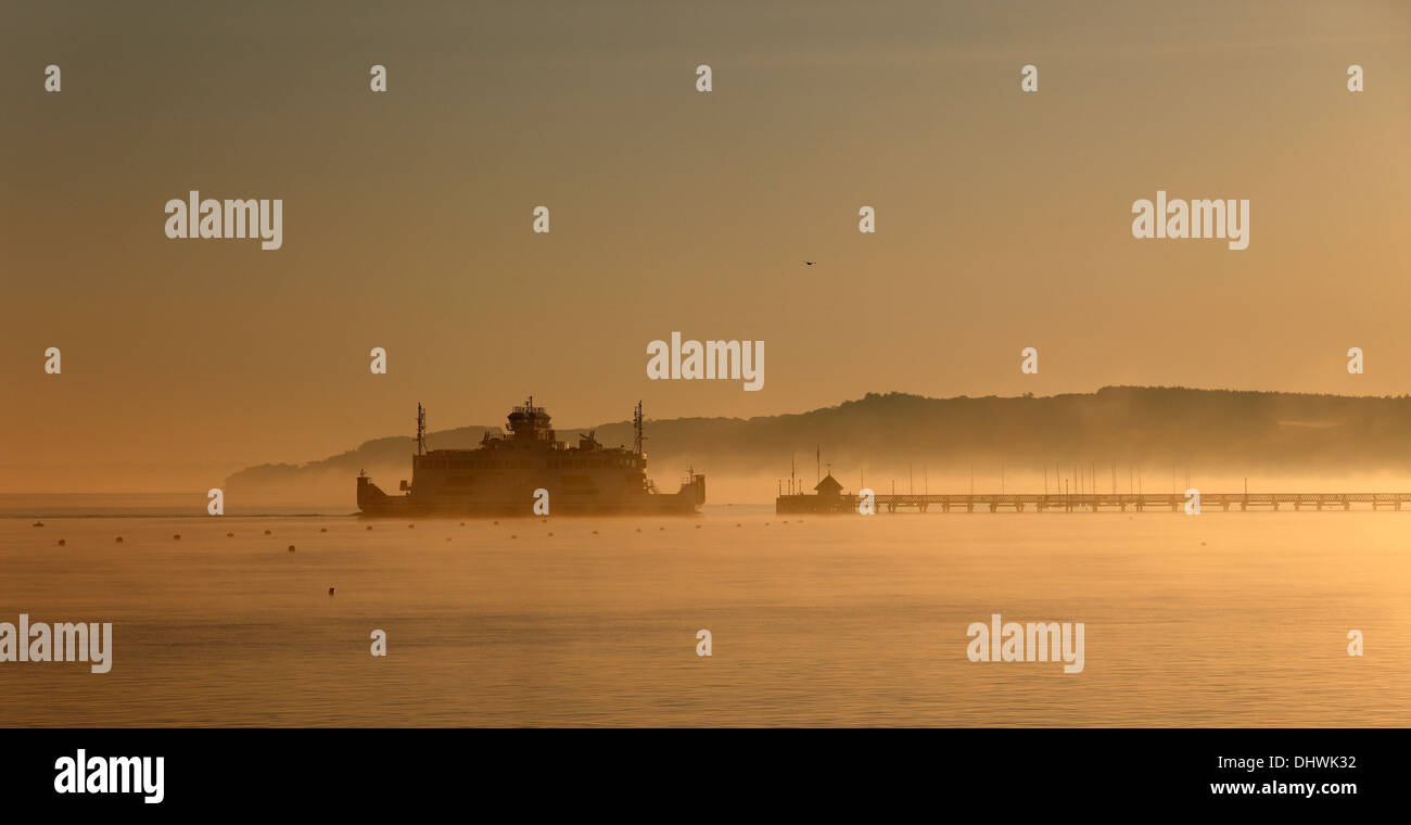 Early morning Wightlink ferry approaching Yarmouth Isle of Wight Hampshire England Stock Photo