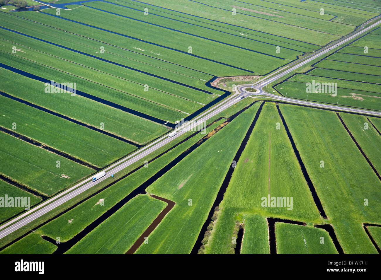 Netherlands, Kamerik, Road crossing polder. Aerial Stock Photo