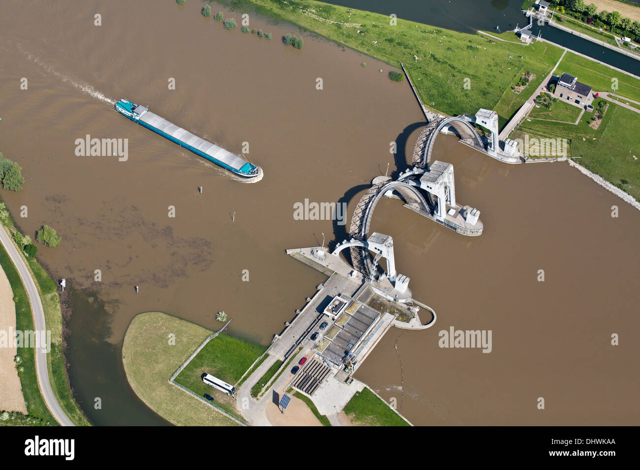 Netherlands, Amerongen. Weir and lock complex in Nederrijn river. Cargo boat. Aerial Stock Photo