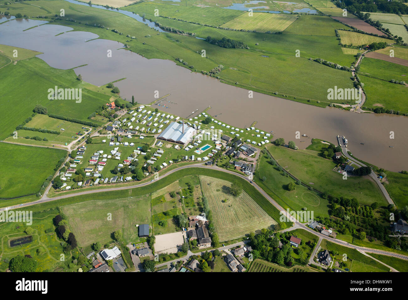 Netherlands, Ingen near Elst. Car ferry crossing Nederrijn river near camping site. Aerial Stock Photo