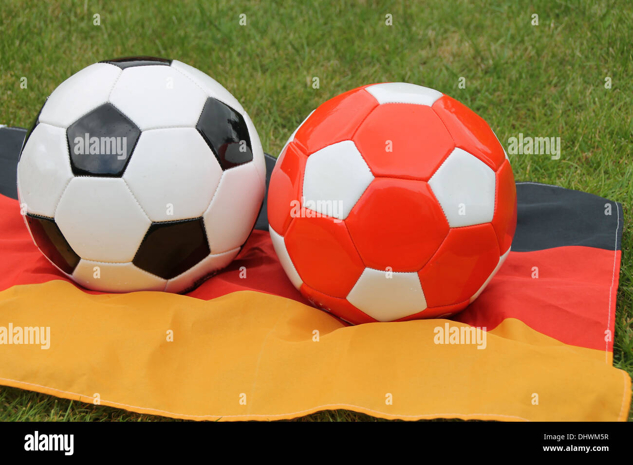 Two footballs on a german flag Stock Photo