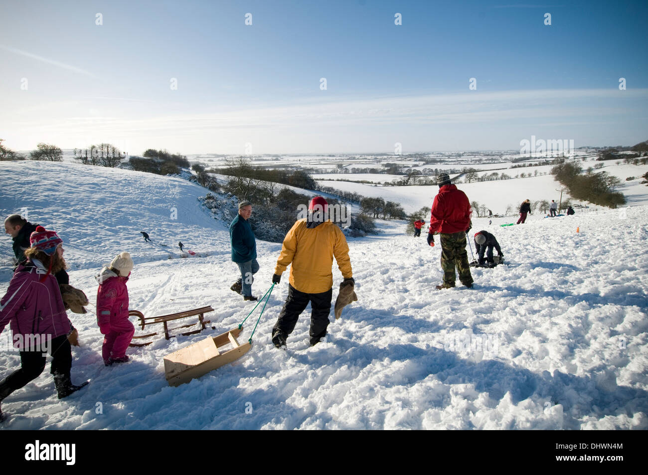 cold weather uk snow snowy snow in Yorkshire children sledging on