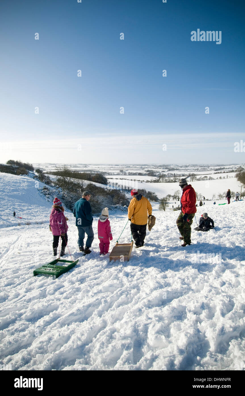 Cold Weather Uk Snow Snowy Snow In Yorkshire Children Sledging On Terrington Bank Near York 