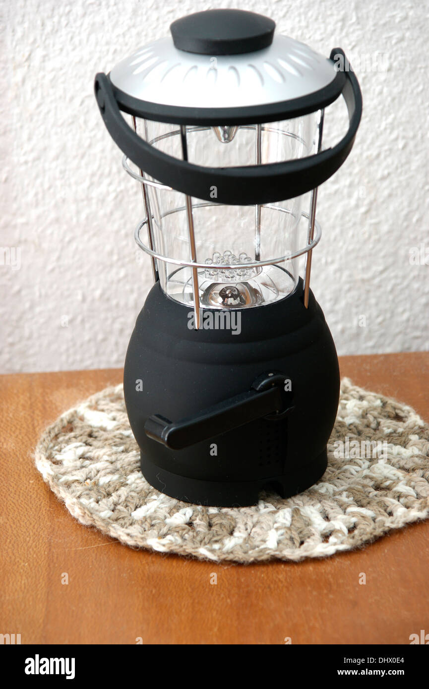 A wind up lantern lamp used for emergency lighting for power cuts power failures & running out of electricity power Stock Photo