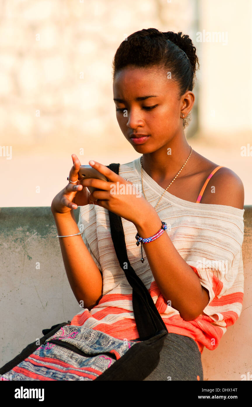 young woman with cell phone, tulear, madagascar Stock Photo - Alamy