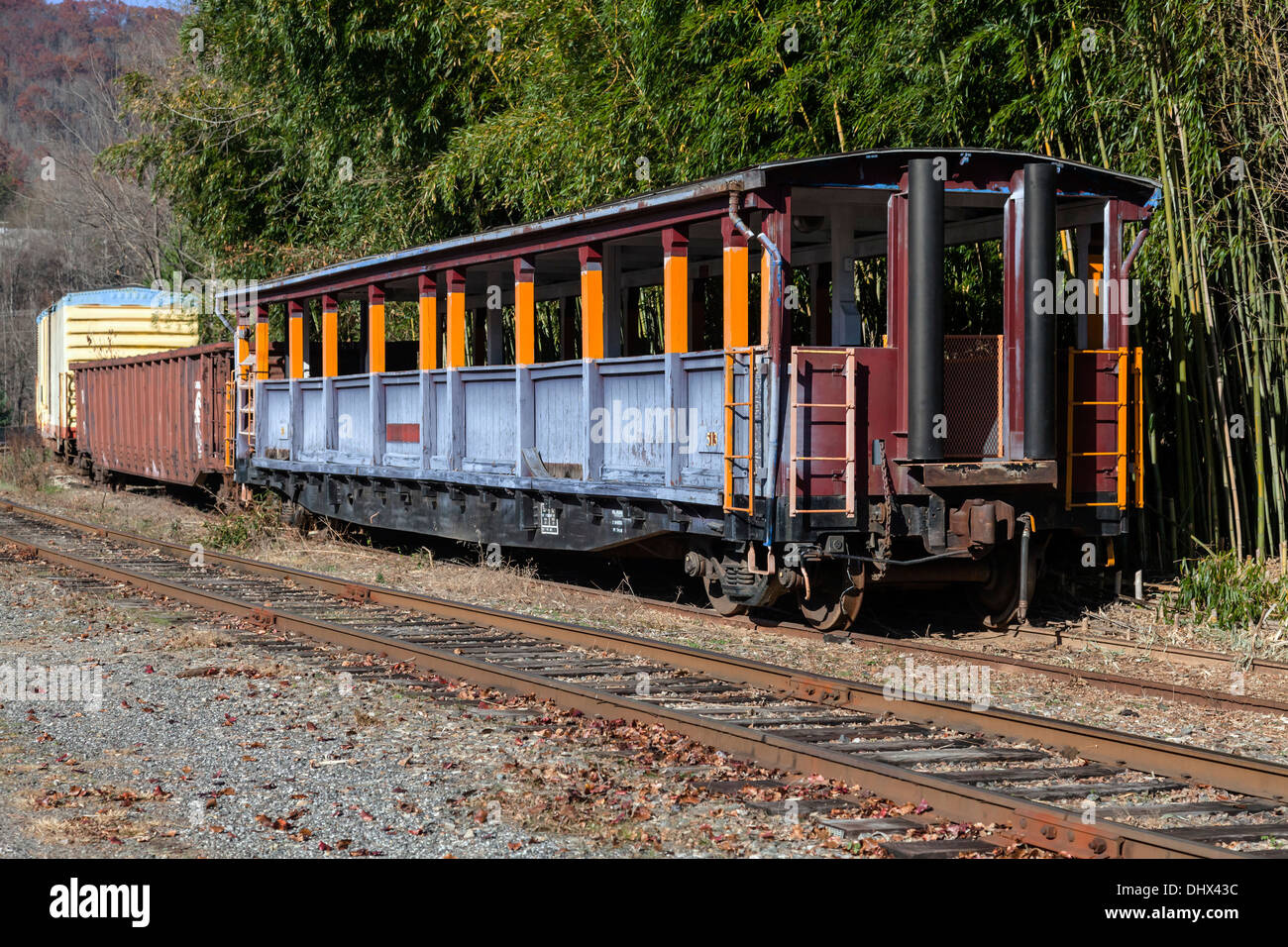 Open passenger railroad car used for Smoky Mountain tours on side spur near Dillsboro and Sylva