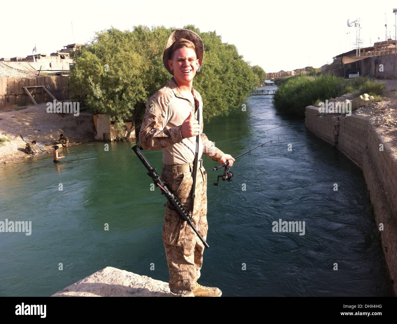 US MARINE RESCUES FOUR ORPHAN RABBITS A U.S. Marine Corps unit worker