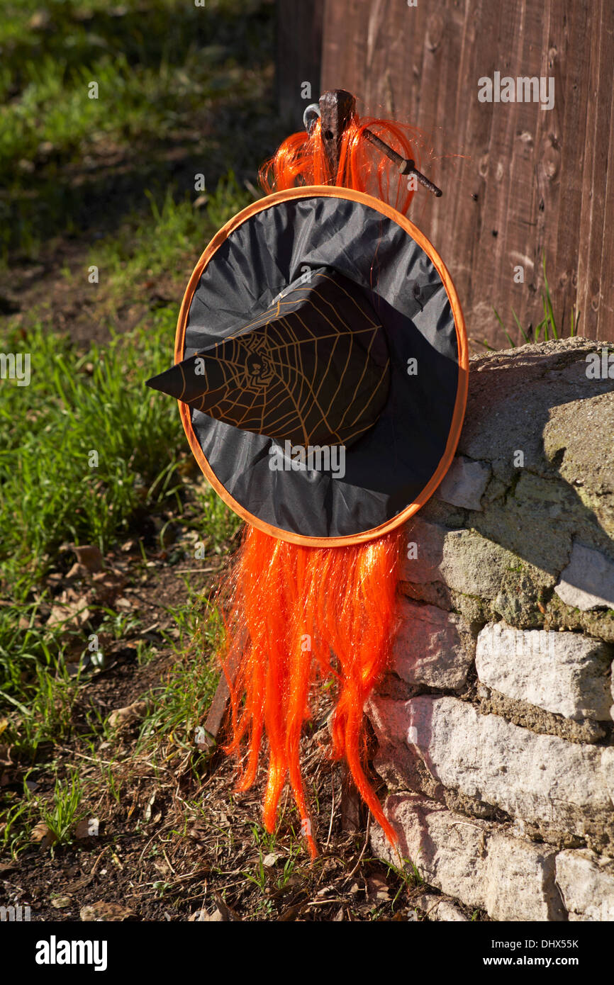 witches hat with orange hair on pole at Bournemouth - remnant from Halloween Stock Photo