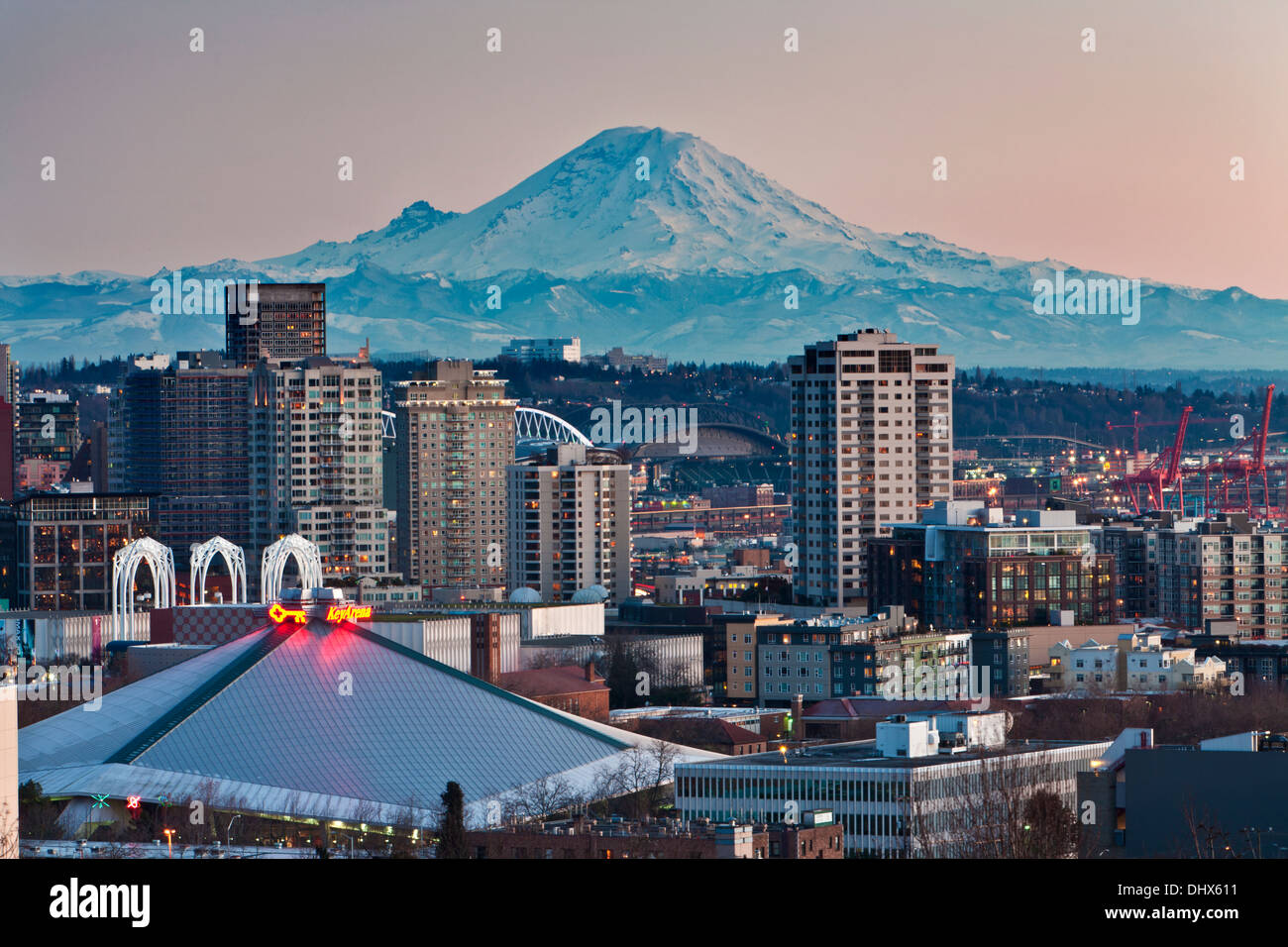 Mount Rainier above the Seattle city skyline at dusk, Seattle, WA Stock Photo Alamy