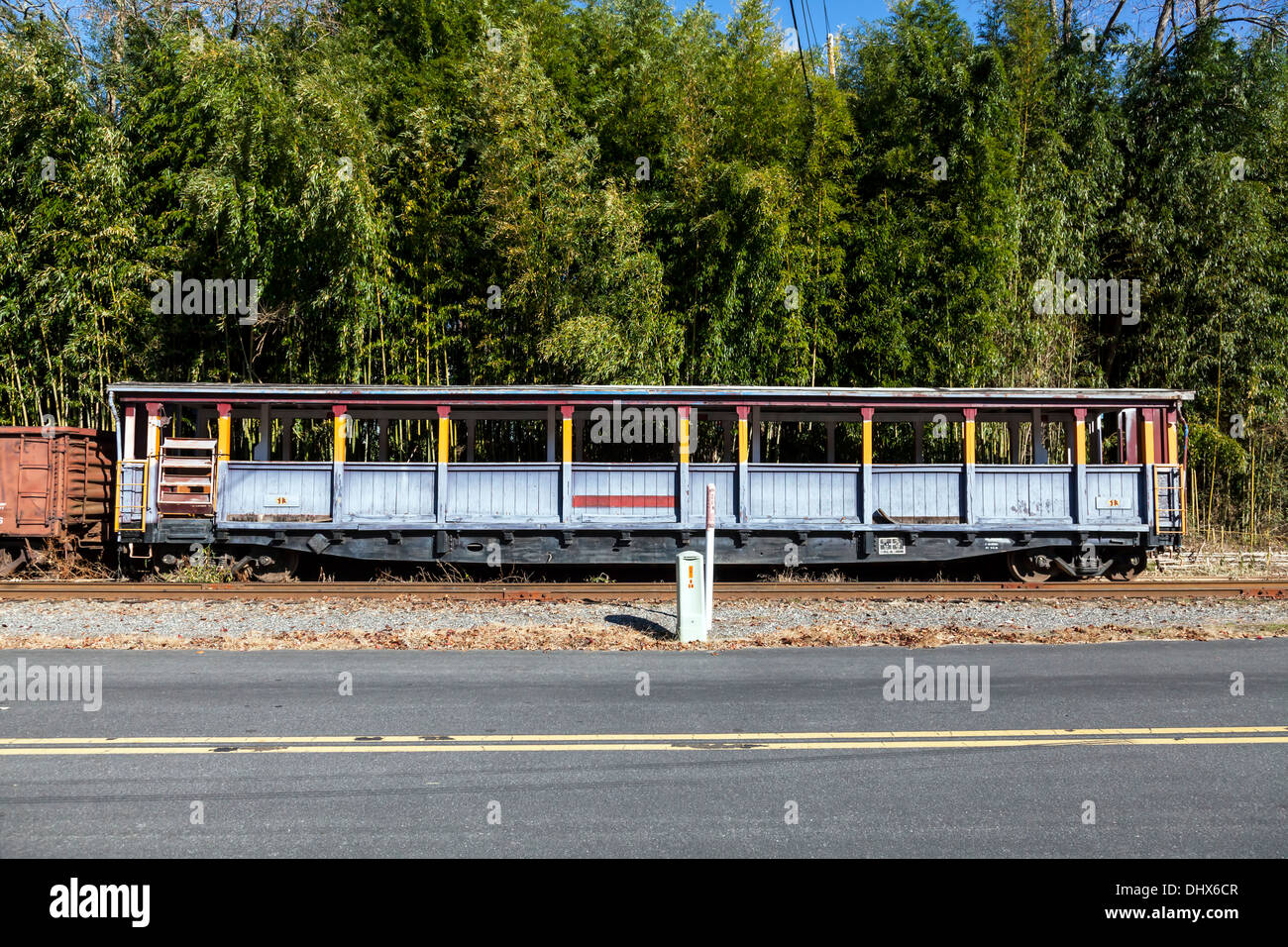 Open passenger railroad car used for Smoky Mountain tours on side spur near Dillsboro and Sylva