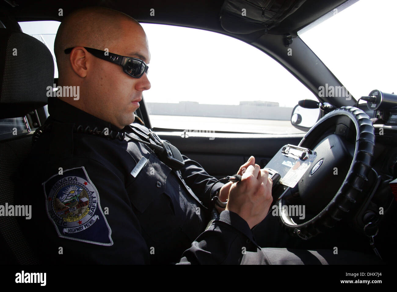 Nevada State Police, State Trooper Highway Patrol officer checks a drivers licence, Las Vegas, Nevada, USA Stock Photo
