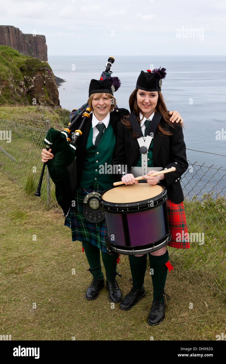 Two Young girls with their bagpipes and drum at Kilt Rock Isle of Skye UK Stock Photo
