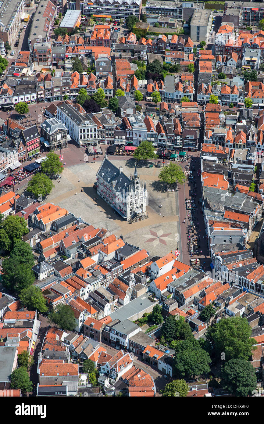 Netherlands, Gouda, Townhall from 15th century on market square. Aerial Stock Photo