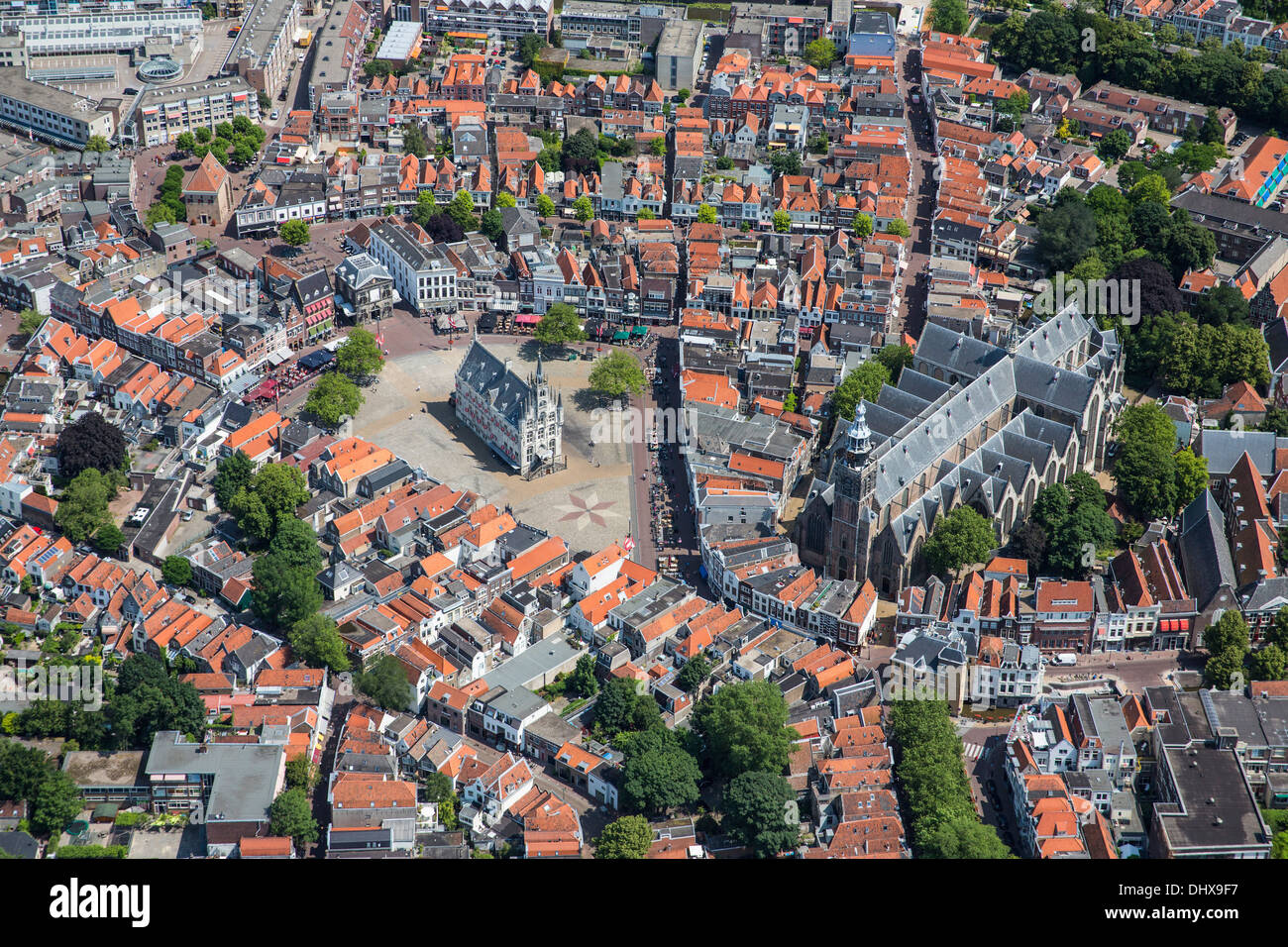 Netherlands, Gouda, Townhall from 15th century on market square. Aerial Stock Photo