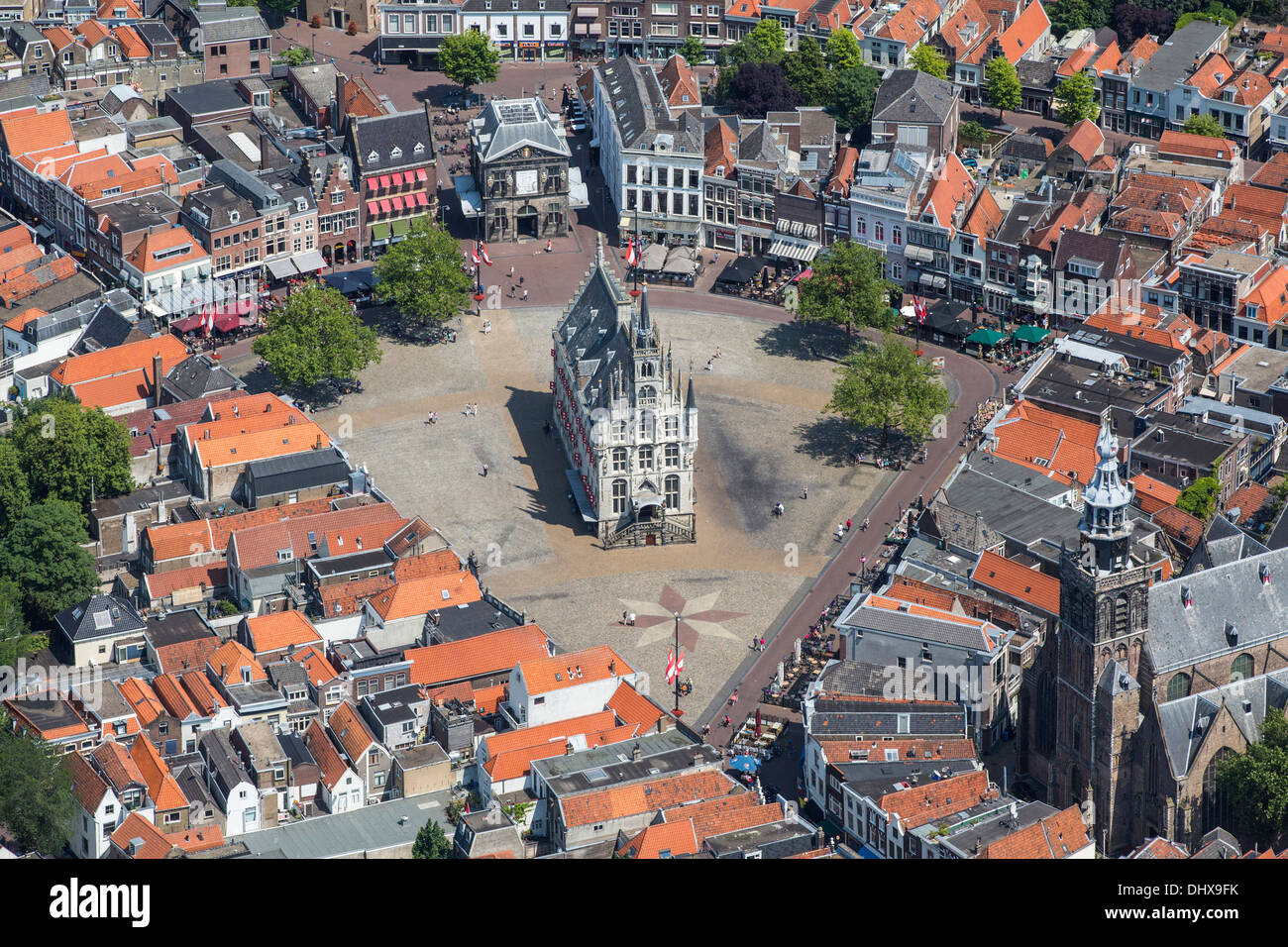 Netherlands, Gouda, Townhall from 15th century on market square. Aerial Stock Photo