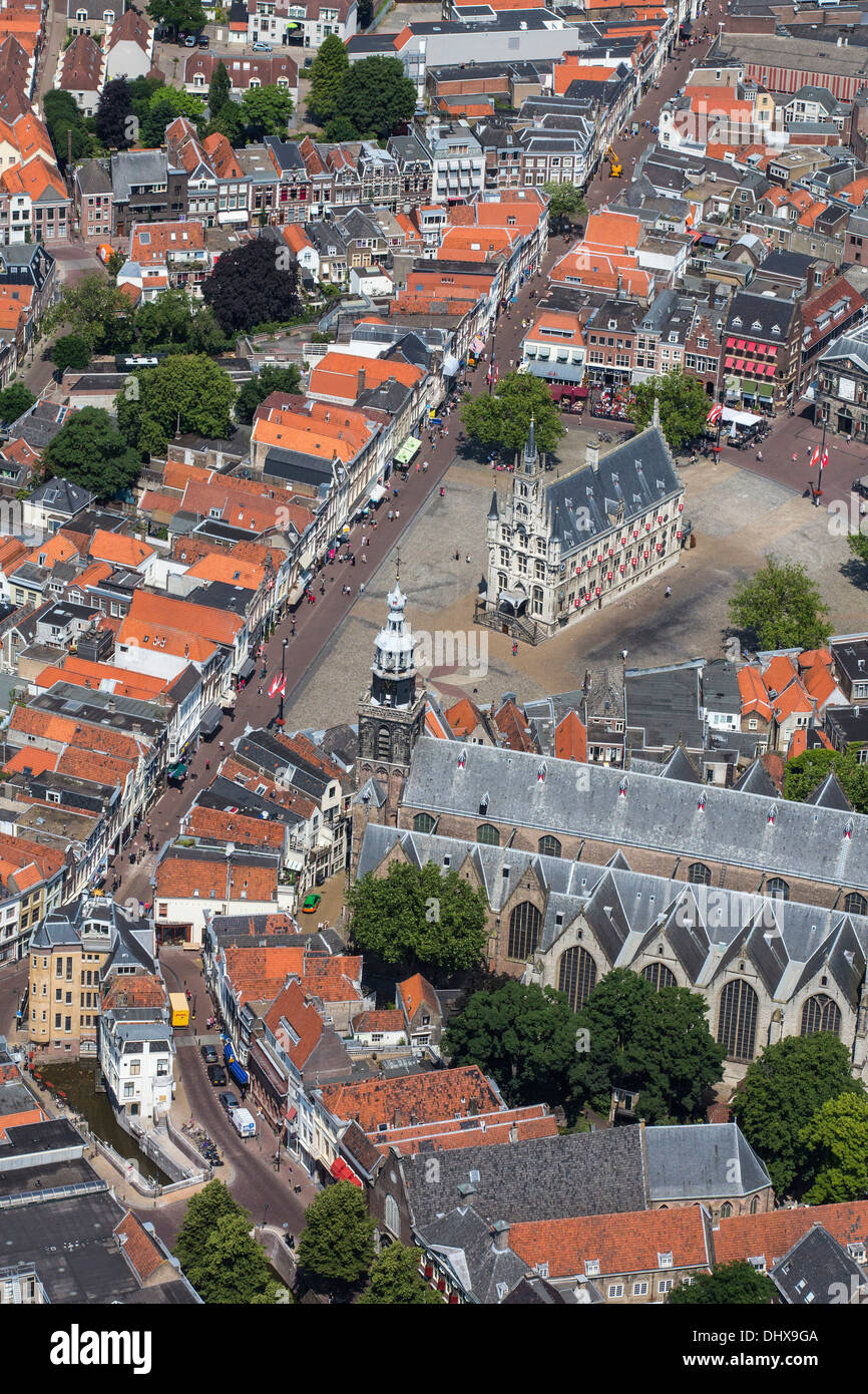 Netherlands, Gouda, Townhall from 15th century on market square. Aerial Stock Photo