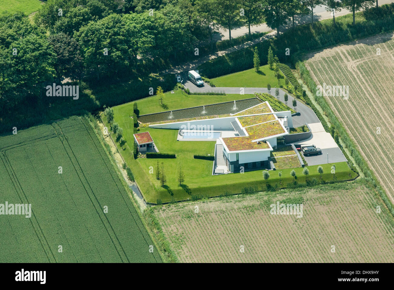 Netherlands, Barendrecht, Modern villa with roof gardens. Aerial Stock Photo
