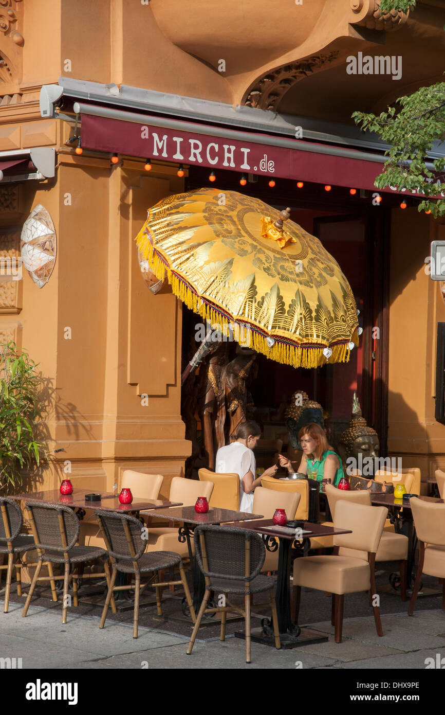 People eating outside Mirchi Restaurant, Berlin, Germany Stock Photo