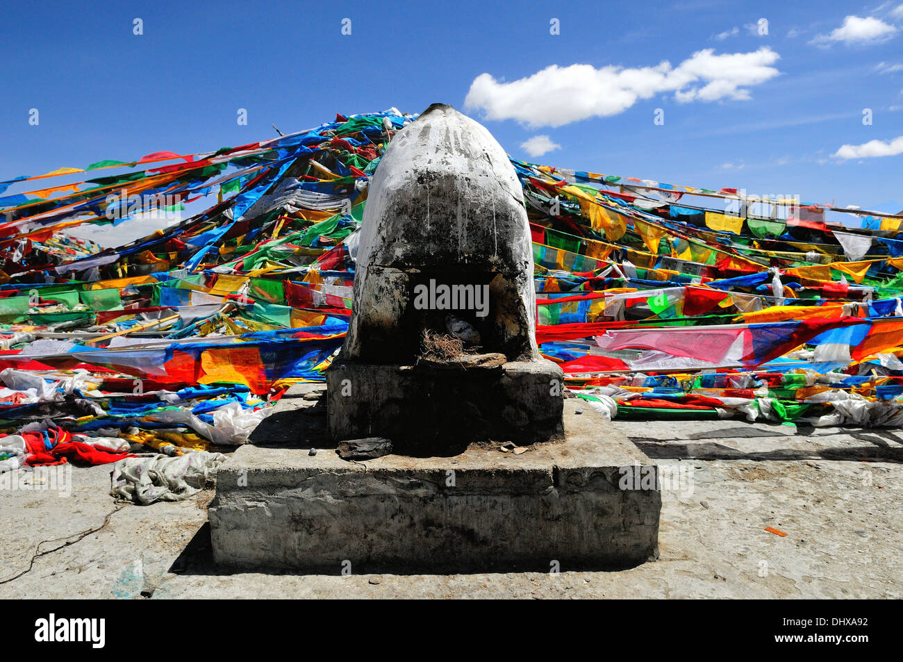 Smoker and prayer flags in Tibet Stock Photo