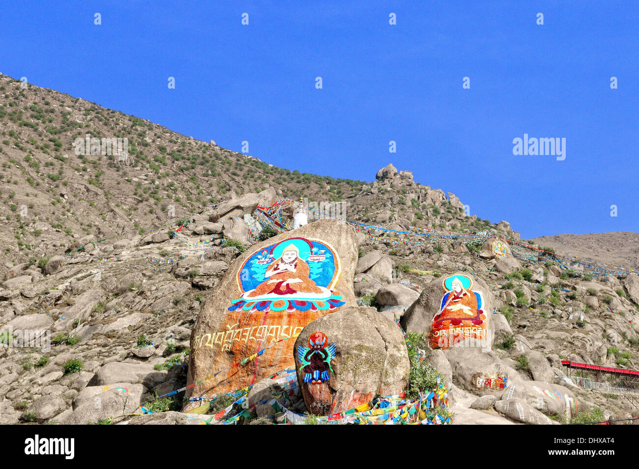 Buddhist painting on the rocks Stock Photo