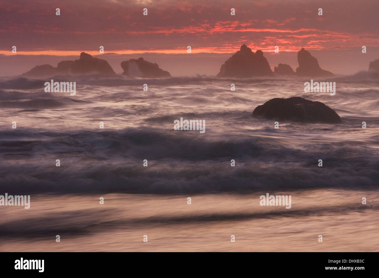 Sunset above sea stacks along Bandon Beach in Bandon Beach State Park, Oregon. Stock Photo