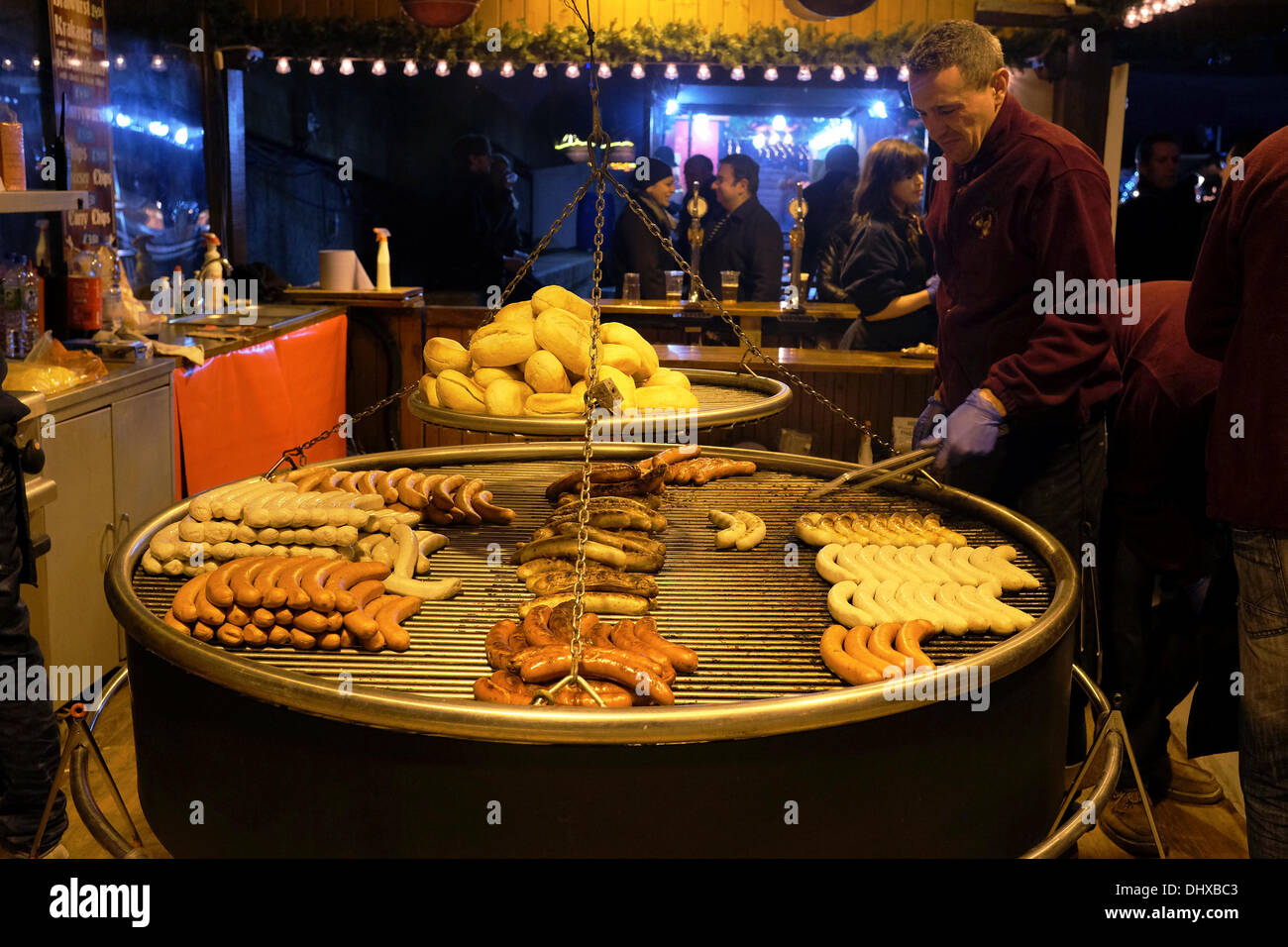 Bratwurst being grilled at German Christmas market, Southbank Stock