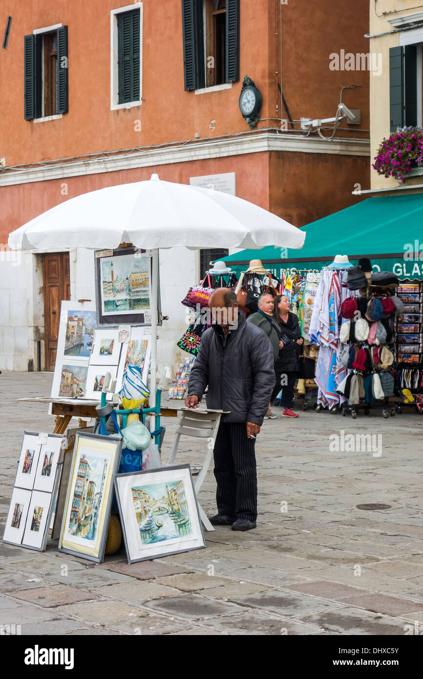 The sights of Venice Venezia Veneto region, northeastern Italy, Europe. Market stall, street seller selling souvenir paintings Stock Photo