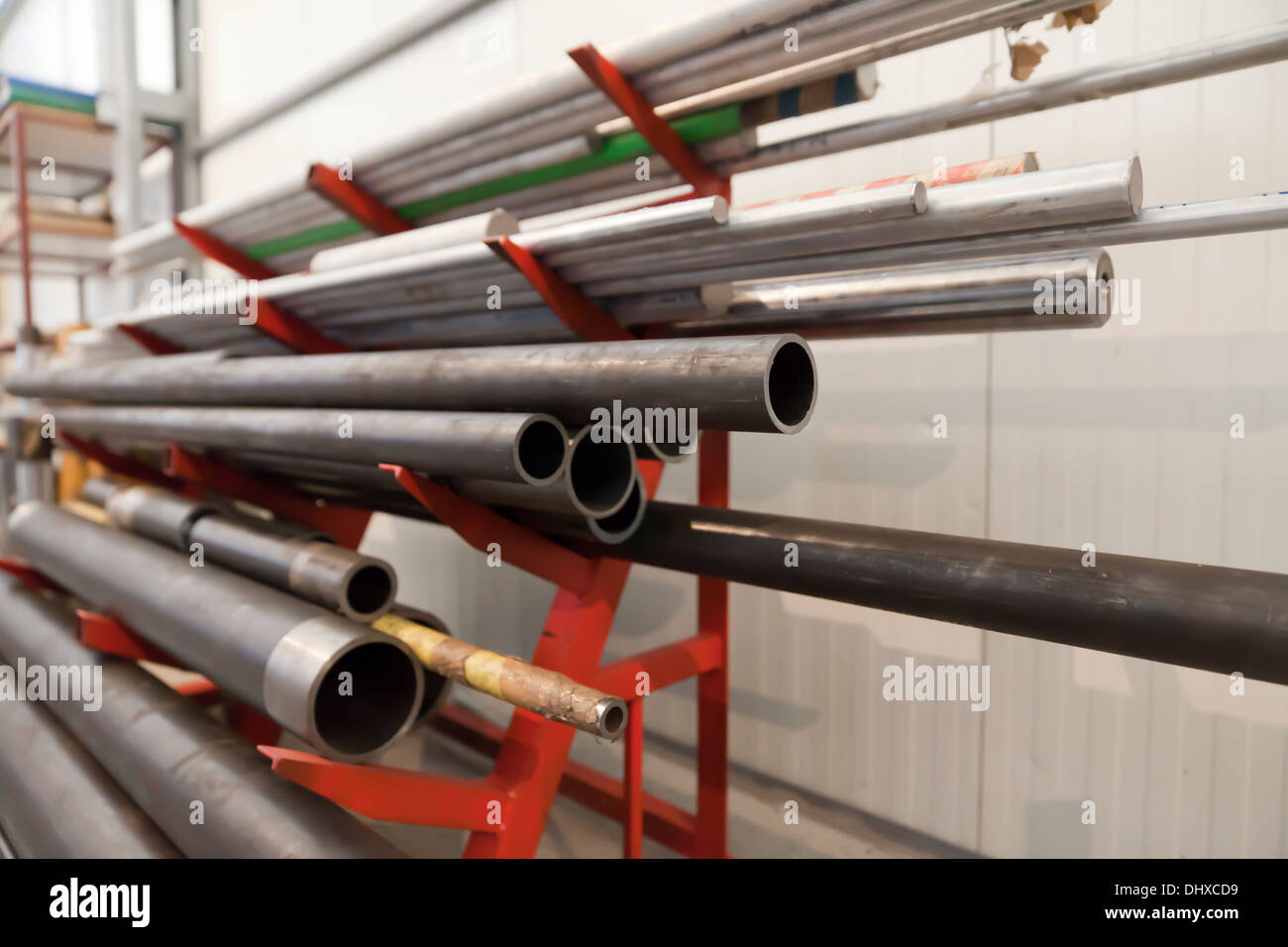 Metal pipe stack on shelf Stock Photo